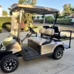 Residents using golf cart inside Ocean Hills community